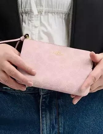 Coach Corner Zip Wristlet In Signature Canvas